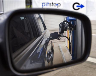 Illustration for article titled A Robot That Pumps Your Gas, At Long Last